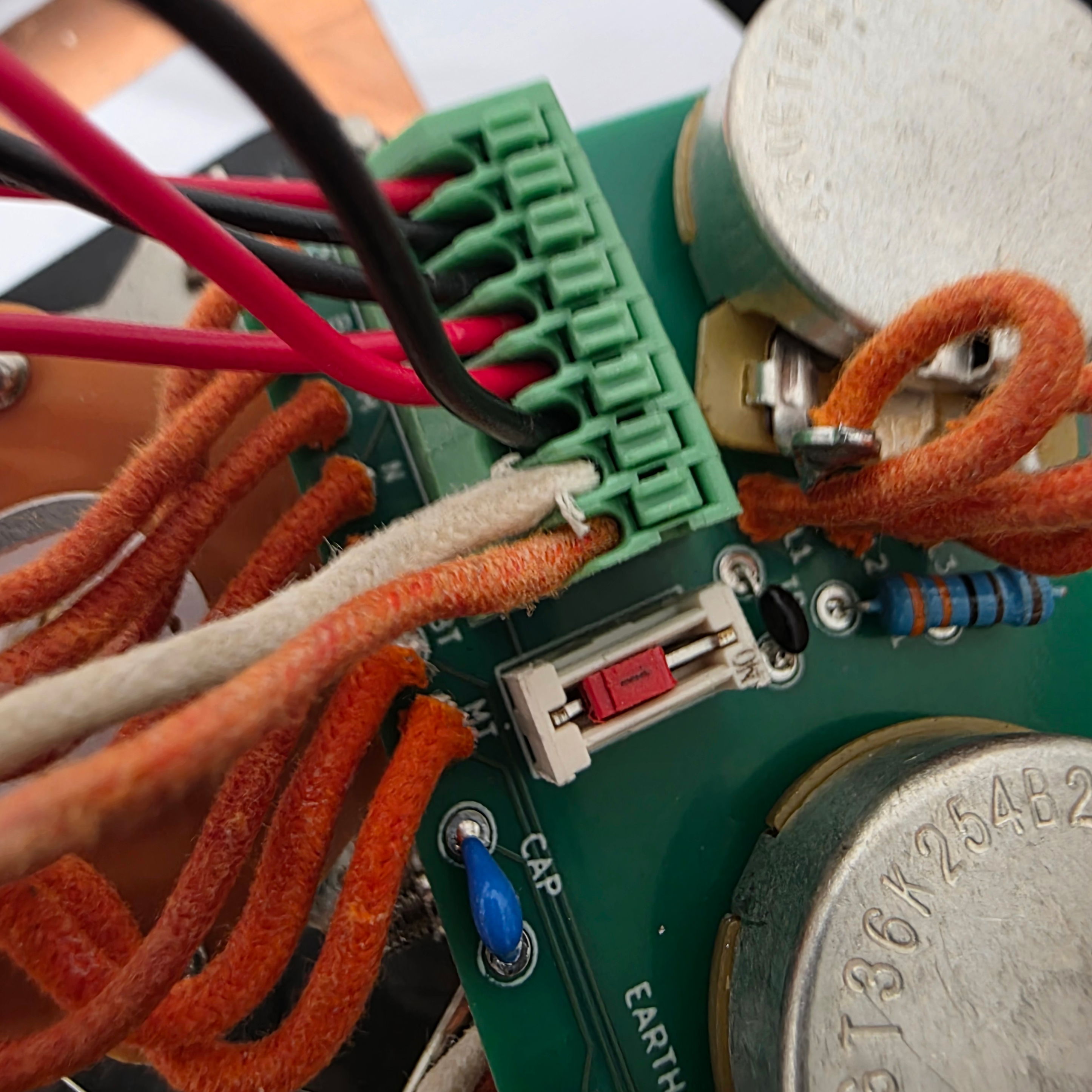 Close-up of a circuit board with connected wires and components.