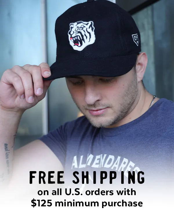 A man wearing a black ballcap with a white tiger patch is in the center of the image with the text 