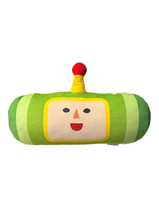 A green and yellow plush toy with a smiling face and a red antenna.