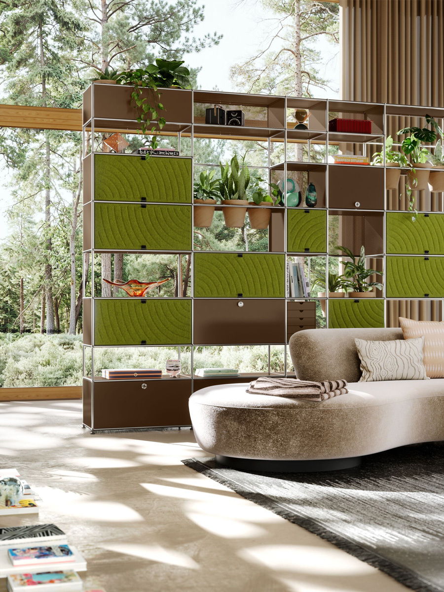 Modern living room with a stylish shelving unit and a cozy sofa.