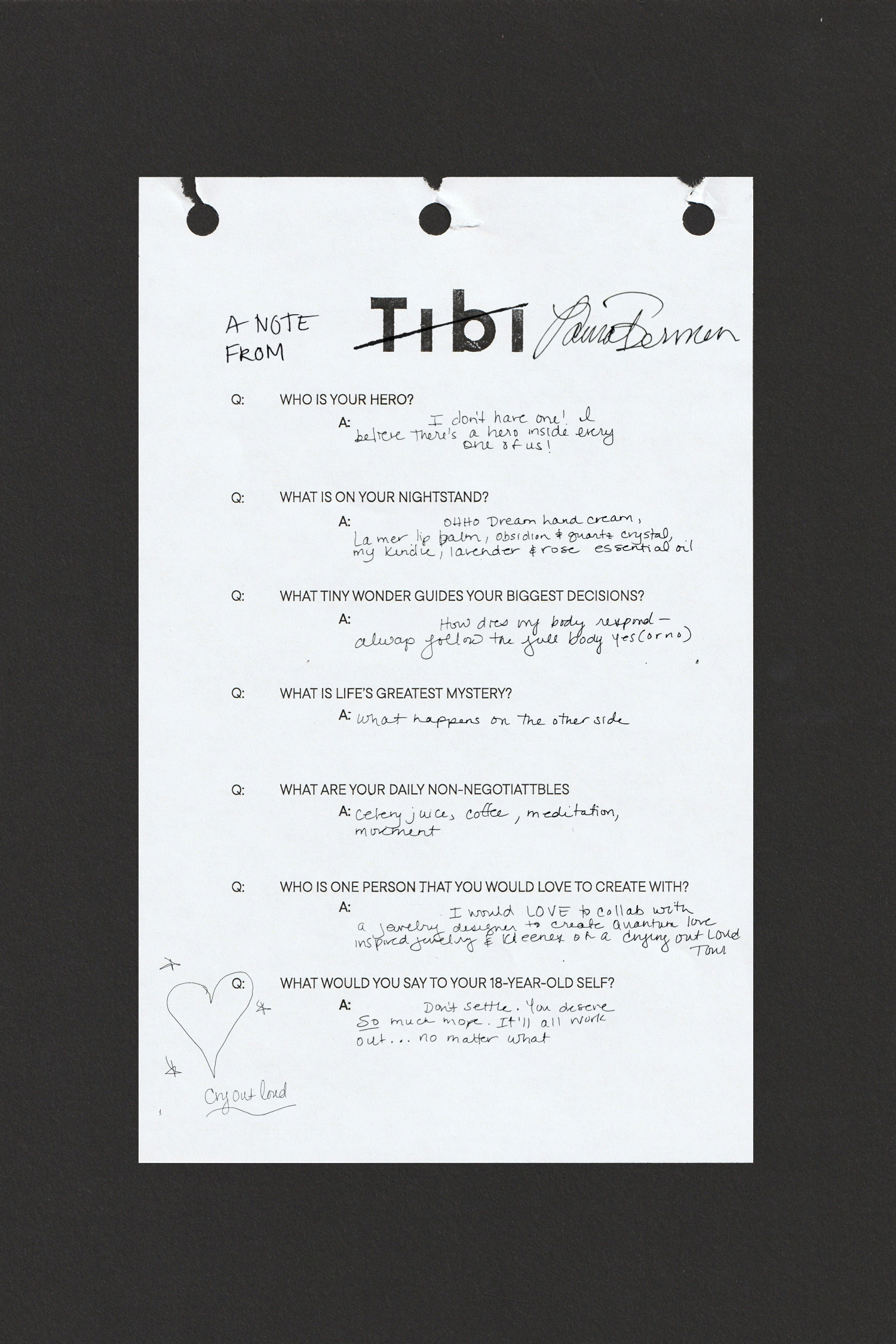 A handwritten note with questions and answers on a white sheet of paper.