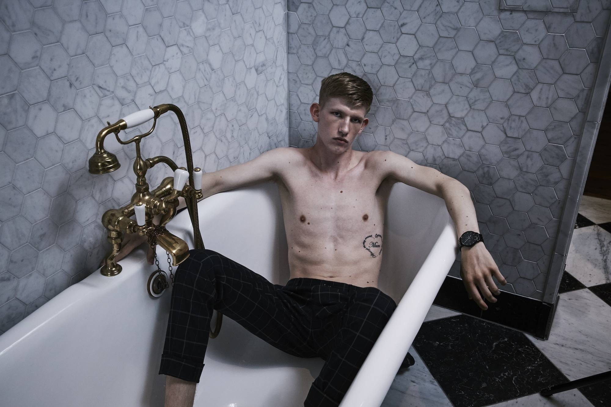 Scottish model Connor Newall bare chested in an antique bath for Kartel Scotland watches AW18 campaign