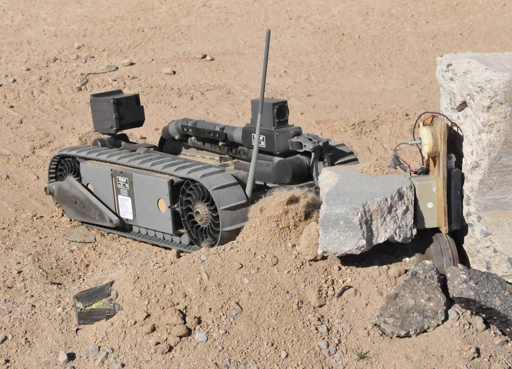 Soldiers from the 1st Stryker Brigade Combat Team, 25th Infantry Division, use the iRobot 510 PackBot to identify and un-arm a simulated improvised explosive device at the Robotics lane located at the U.S. Army's National Training Center in Fort Irwin, Calif. The 510 PackBot is used by infantry soldiers to identify roadside bombs other IEDs. For the soldiers on the front lines the robot allows them to assess areas from a safe distance. The soldiers from the 1/25th SBCT are currently conducting a wide variety of training at NTC in preperation for their deployment to Afghanistan in spring.