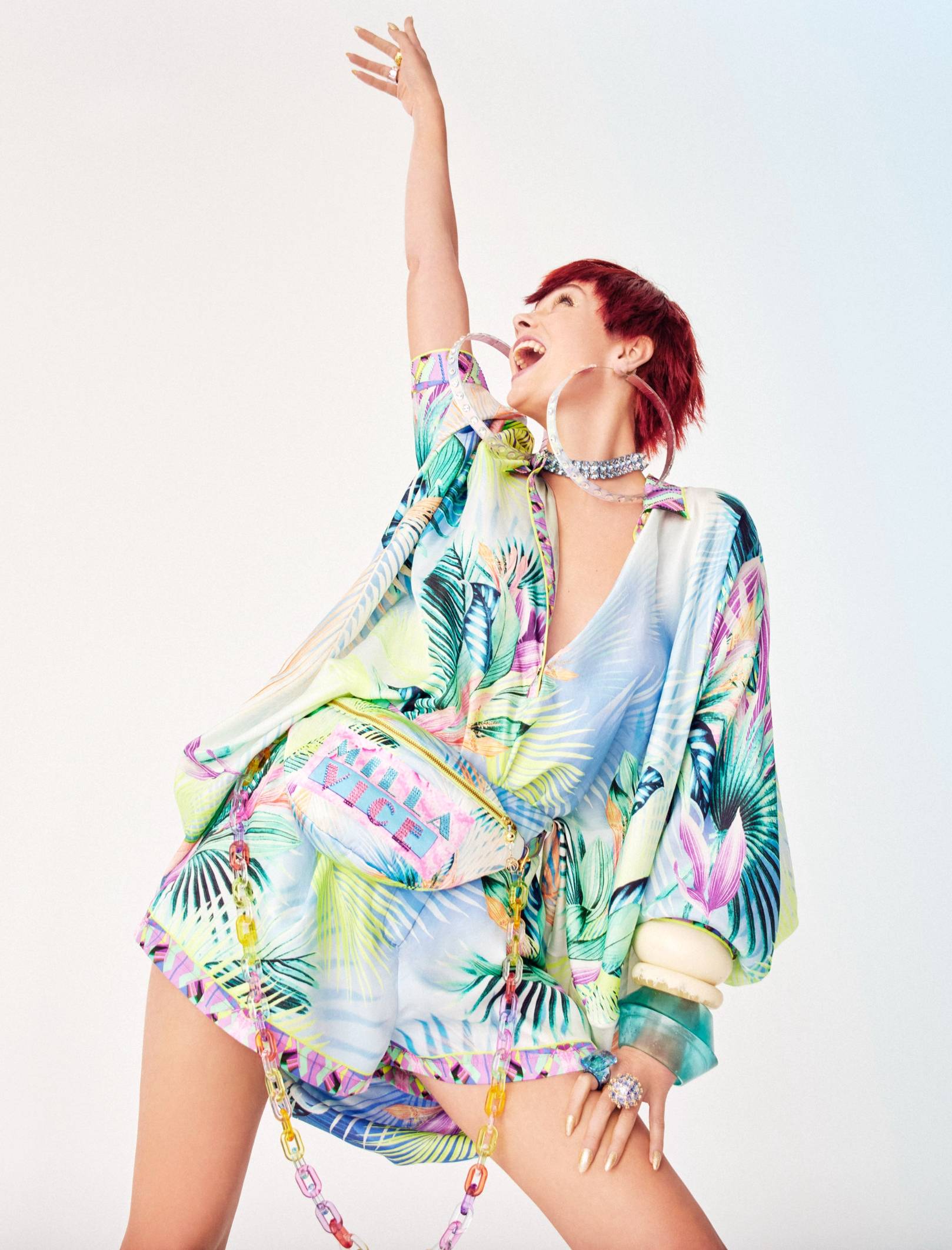 miami vice blue pink and green palm printed outfit on model