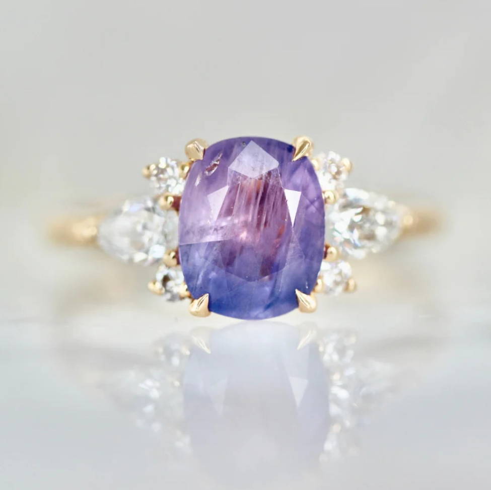 oval cut blue-purple opalescent sapphire ring