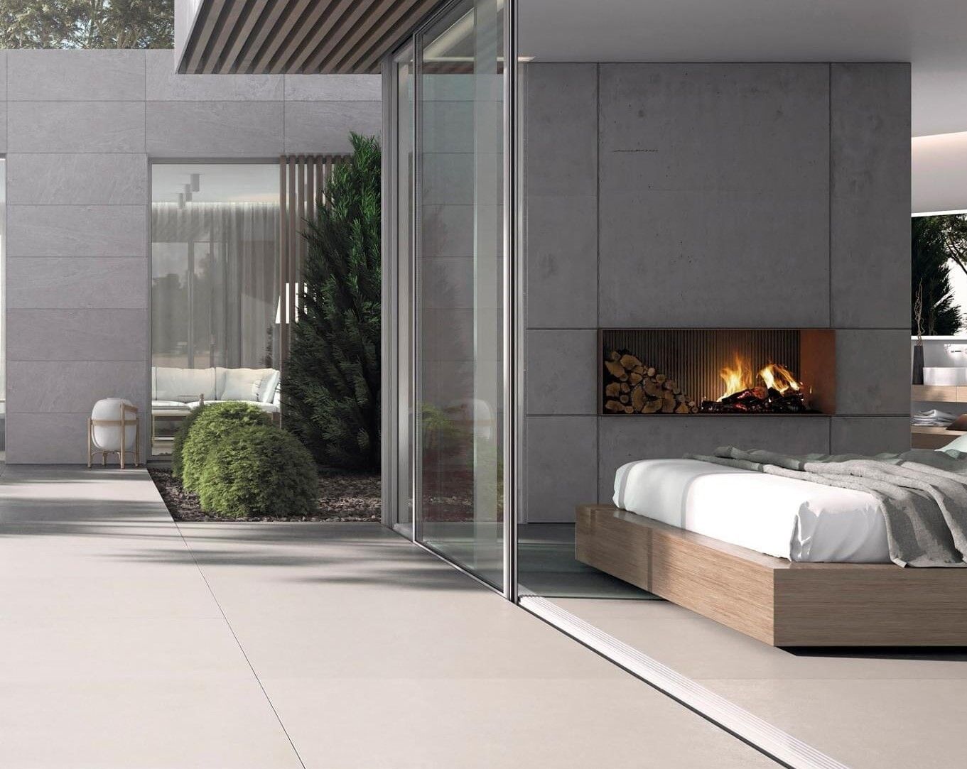 Modern bedroom with large glass doors and an outdoor view.