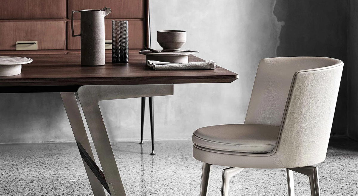 Modern FLEXFORM dining table with a white chair and minimalist decor.