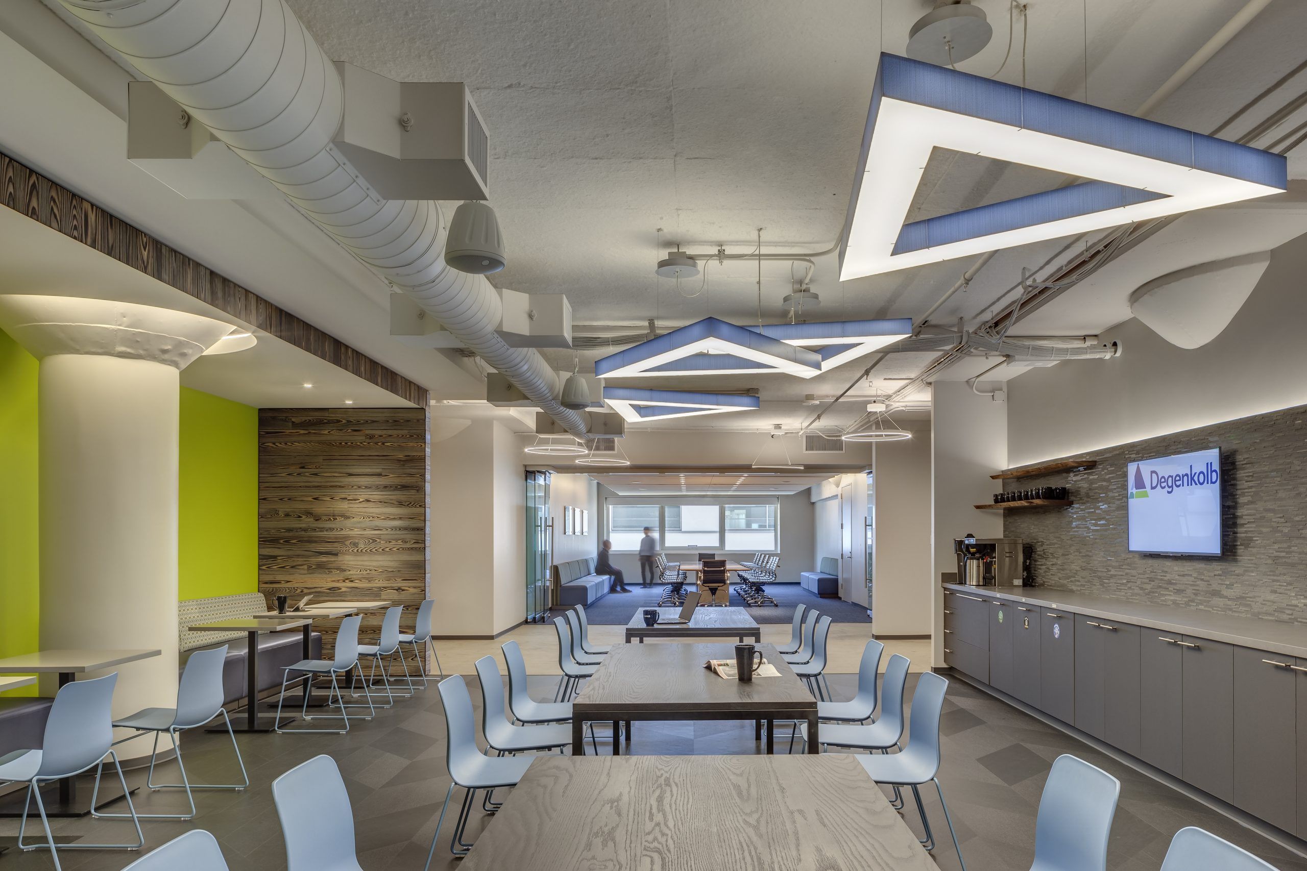 Modern indoor space with stylish lighting and seating arrangements.