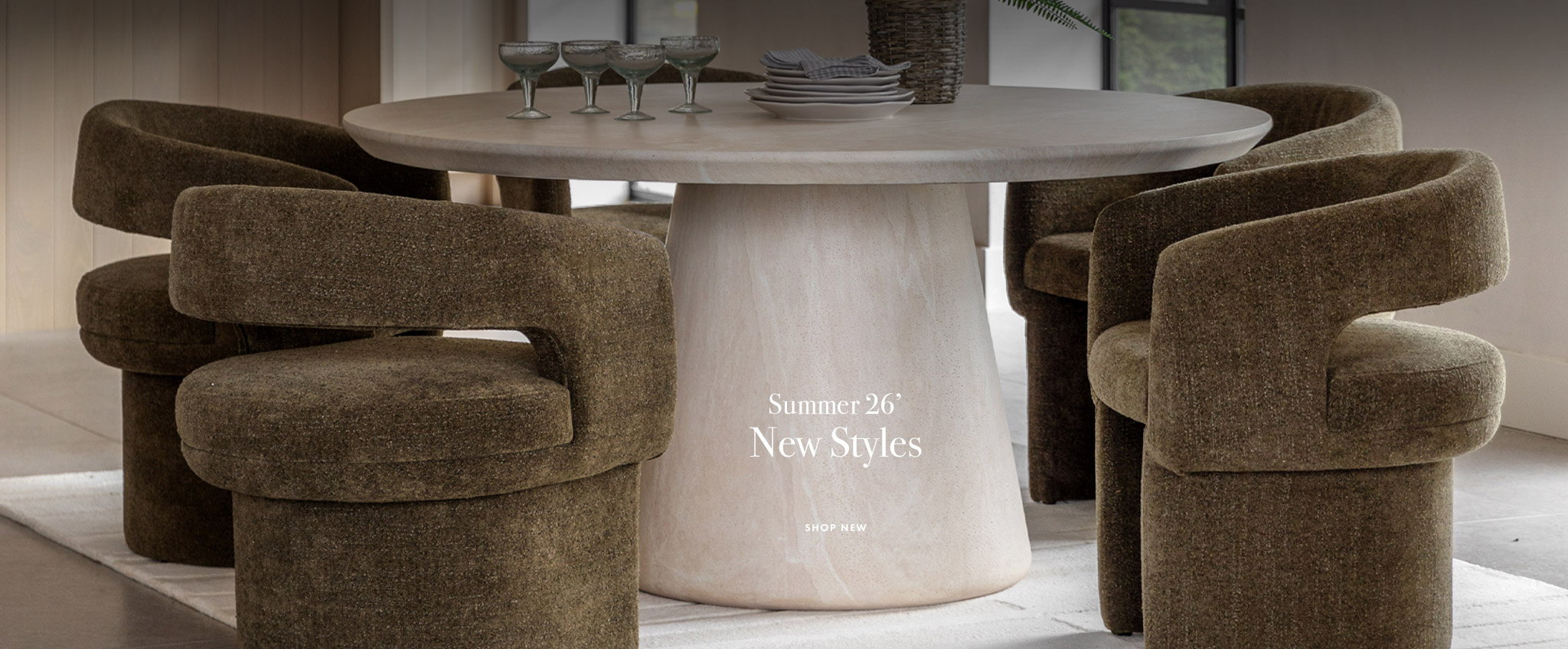 New dining chairs around a ceramic travertine indoor dining table.