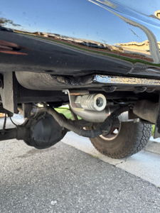 Quick-connect air coupler mounted on the undercarriage of Noah's 1997 Ford F250