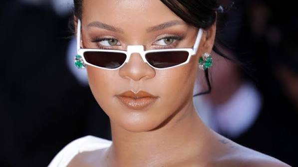Hollywood celebrity Rihanna wearing tiny sunglasses