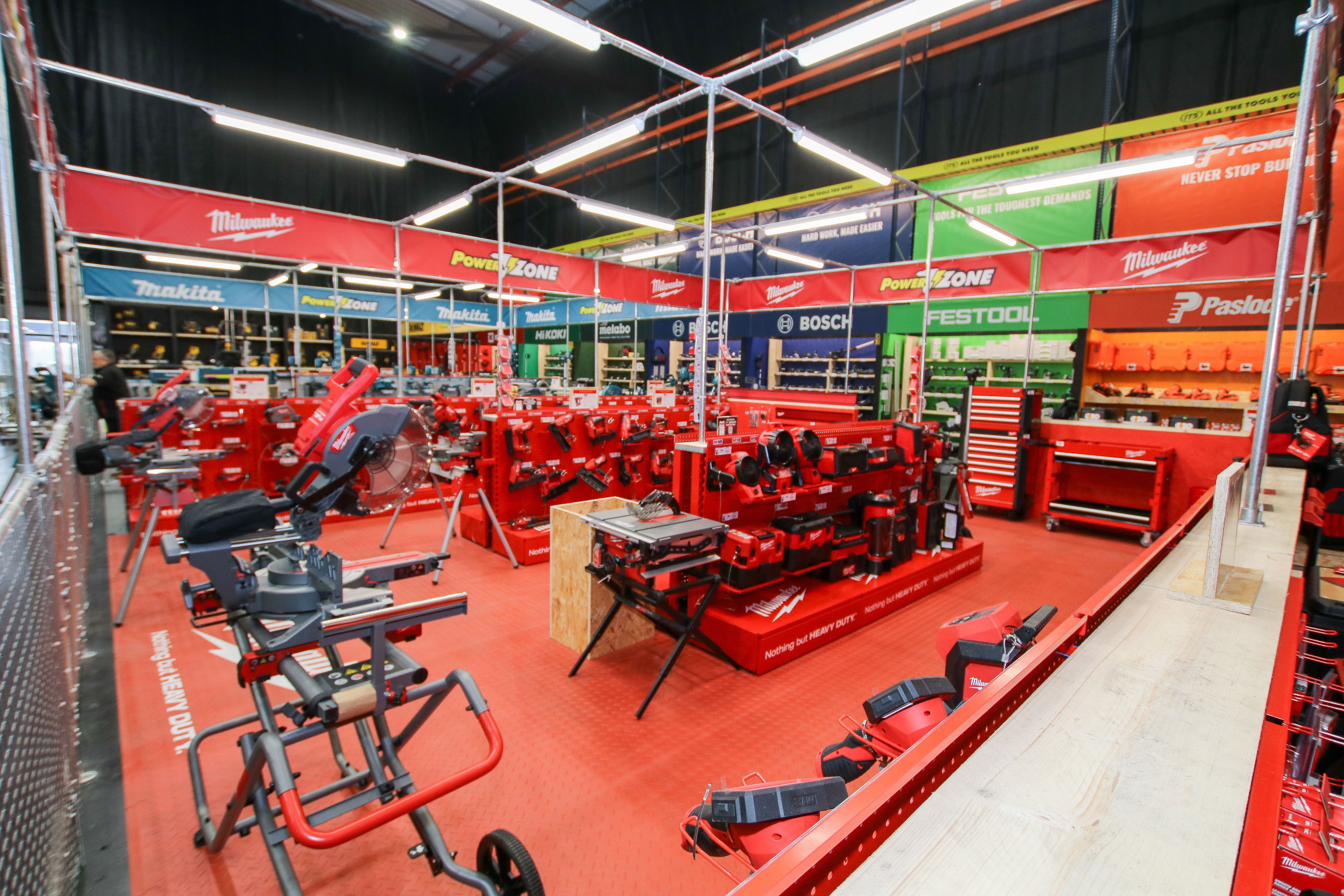 A display of various red tools and equipment in a store setting.