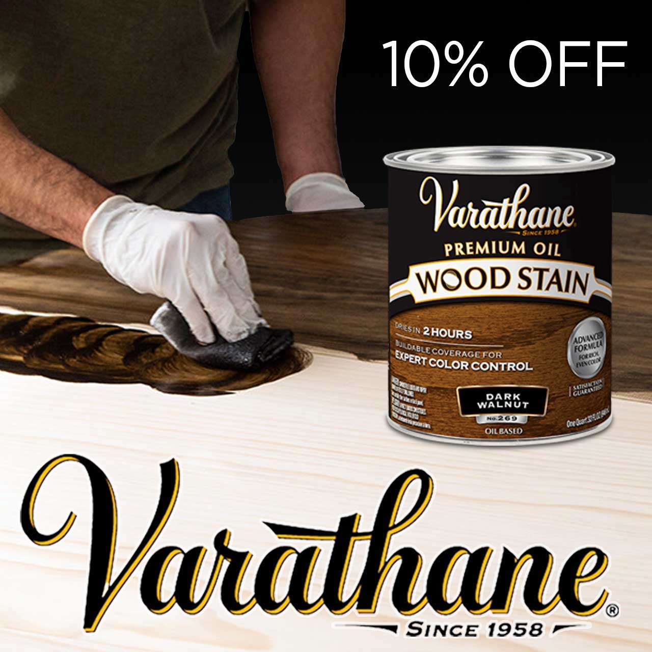 Person applying wood stain with Varathane can in the foreground, discount displayed.