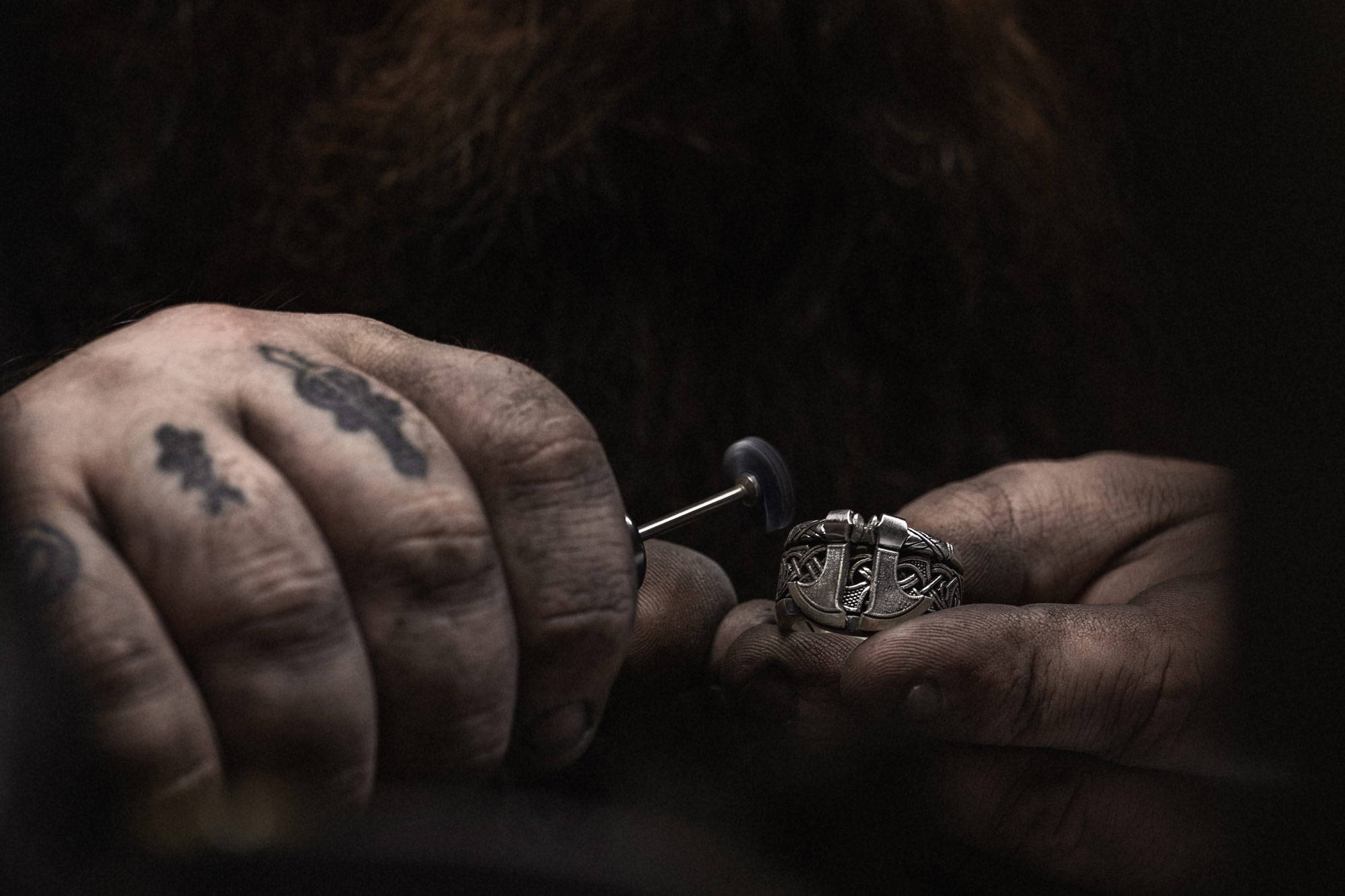 Close up of a NightRider Jeweler crafting an Einherjar Band ring