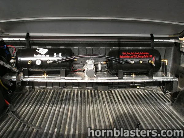 Air tanks and onboard air compressor system mounted in the bed of Jerry's 2006 Chevrolet Silverado 1500, install photo 5