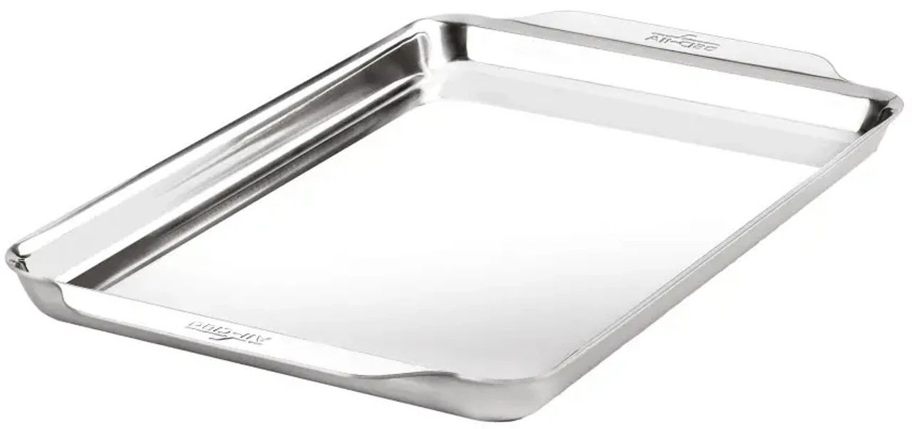 Shiny stainless steel baking tray on a white background.