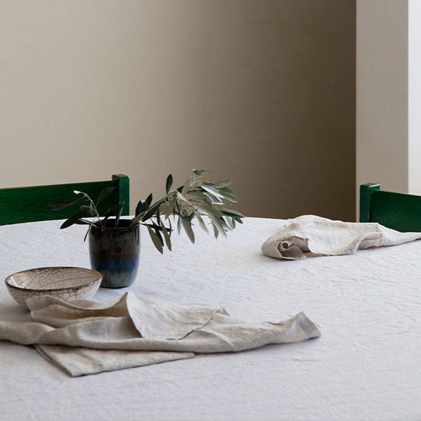 Table setting with Cultiver tablecloth and linen napkins. 