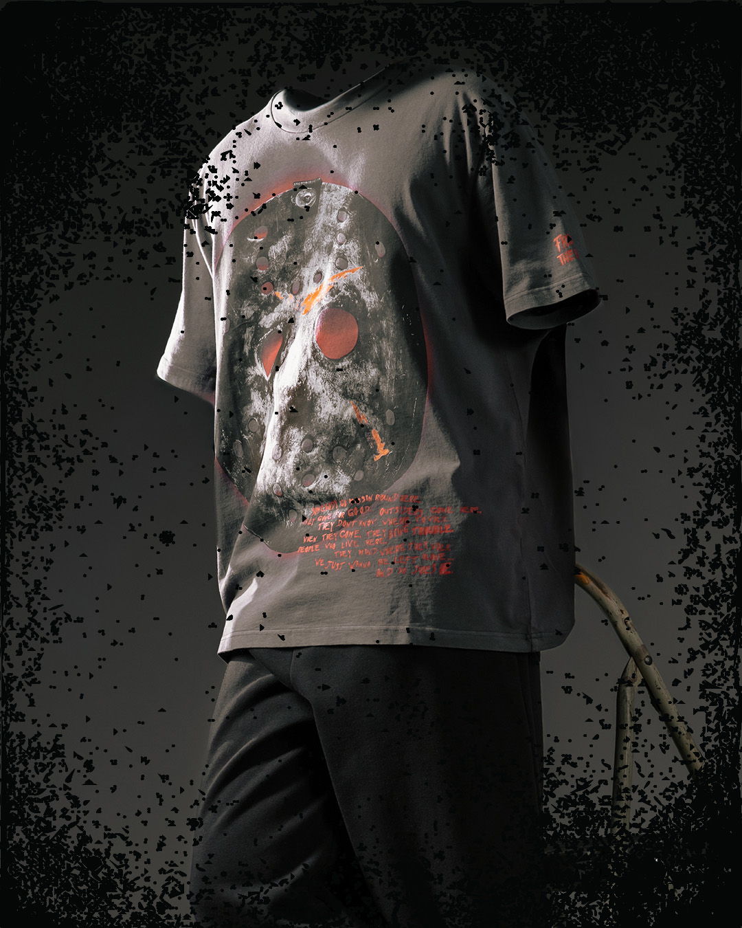 Black t-shirt featuring a skull graphic and red accents.