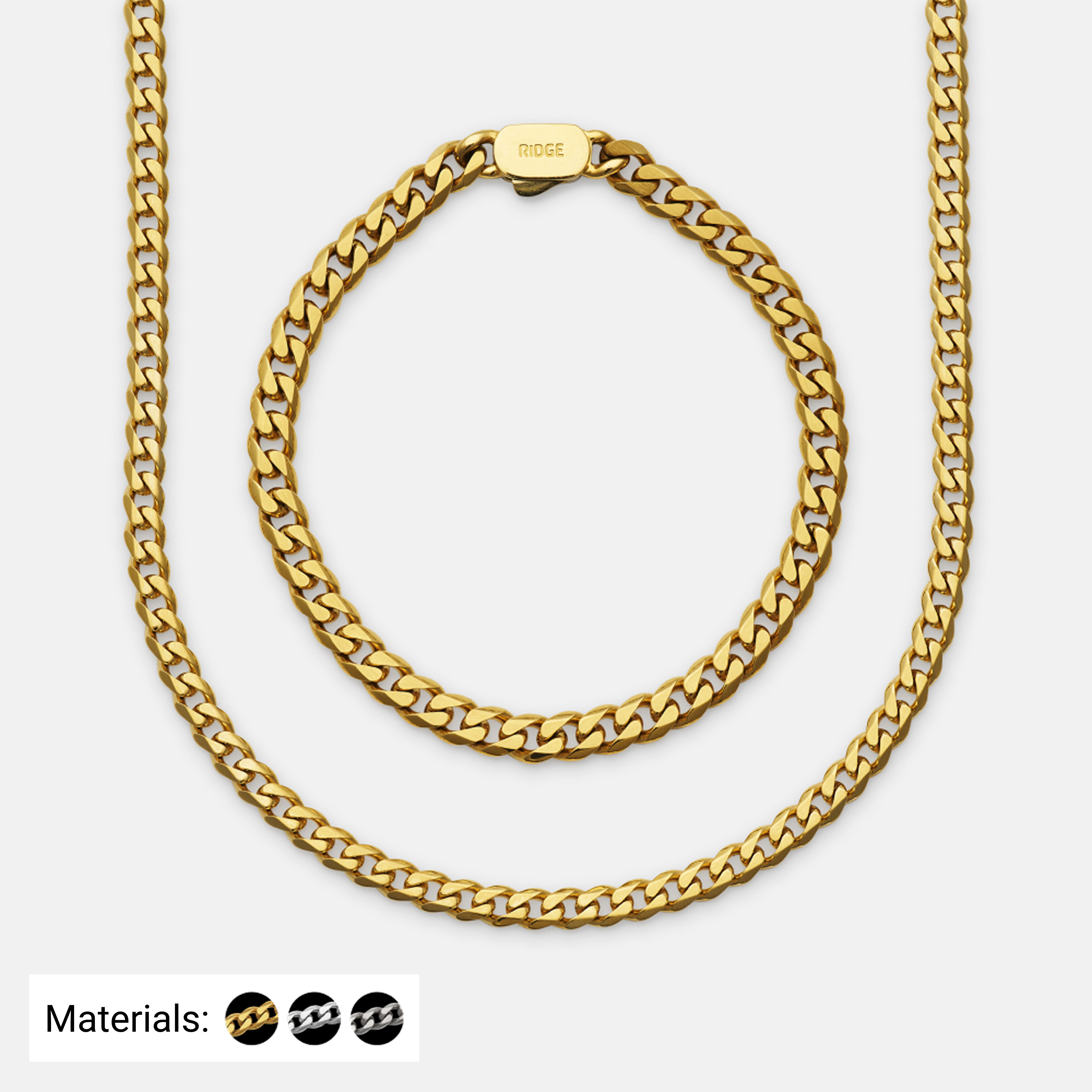 Gold chain necklace and bracelet displayed on a plain background.
