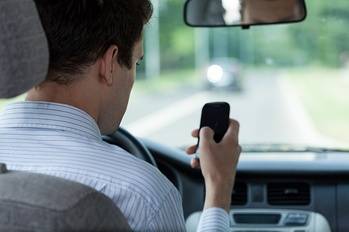 Distracted driver not paying attention to road