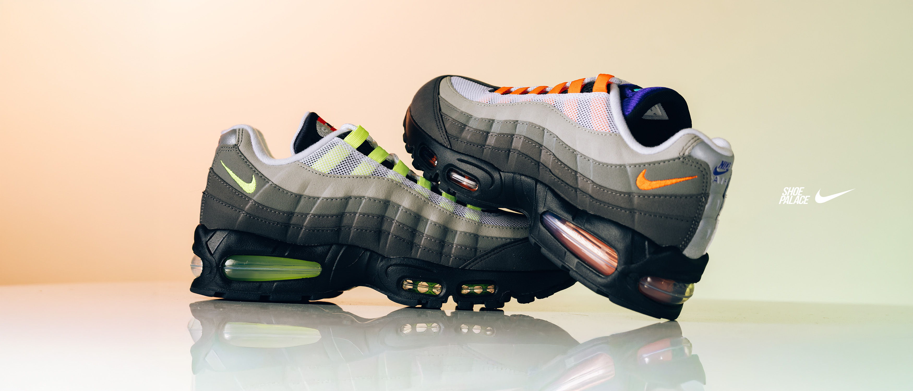 A pair of Nike Air Max 95 sneakers in gray tones.