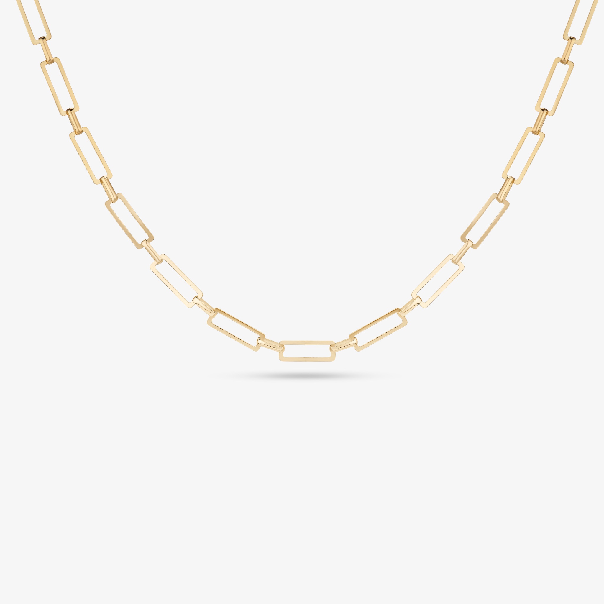 Gold rectangular link necklace on a white background.