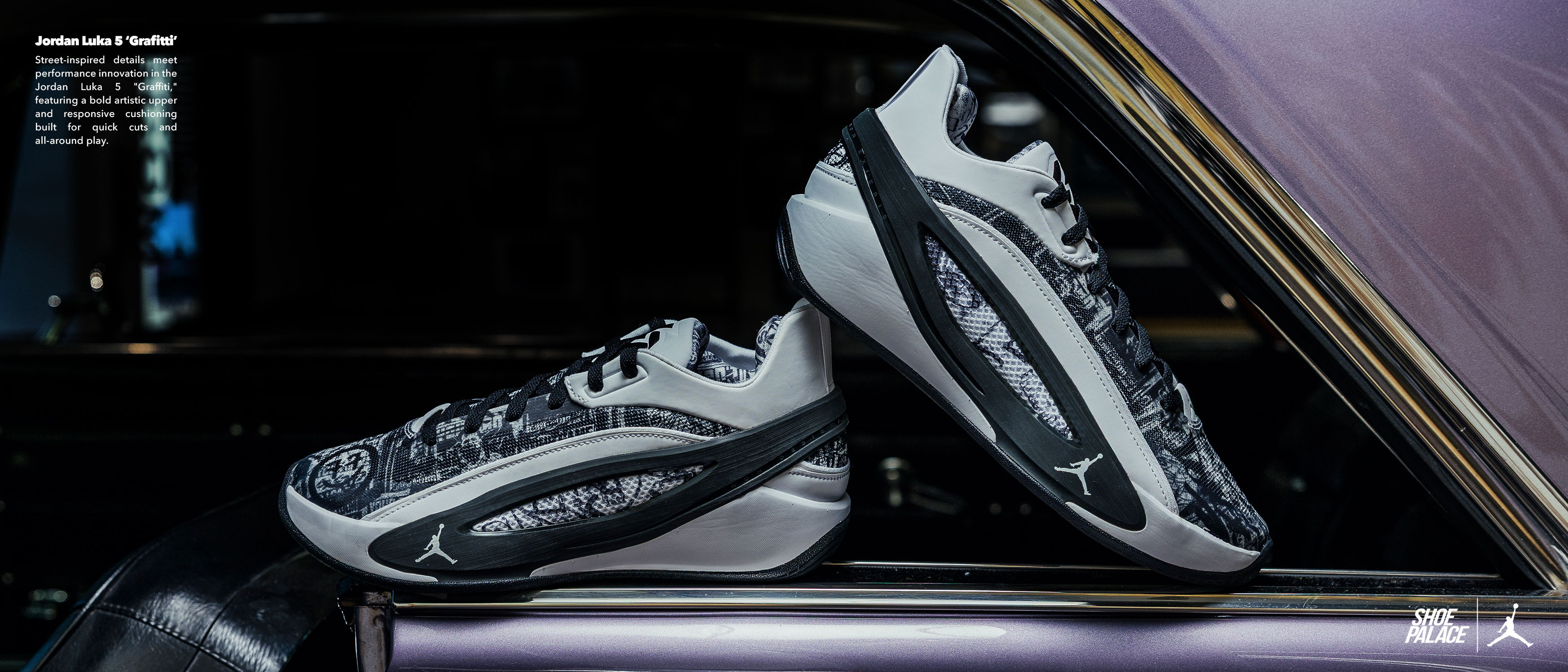 A pair of stylish black and white athletic shoes on a car window.
