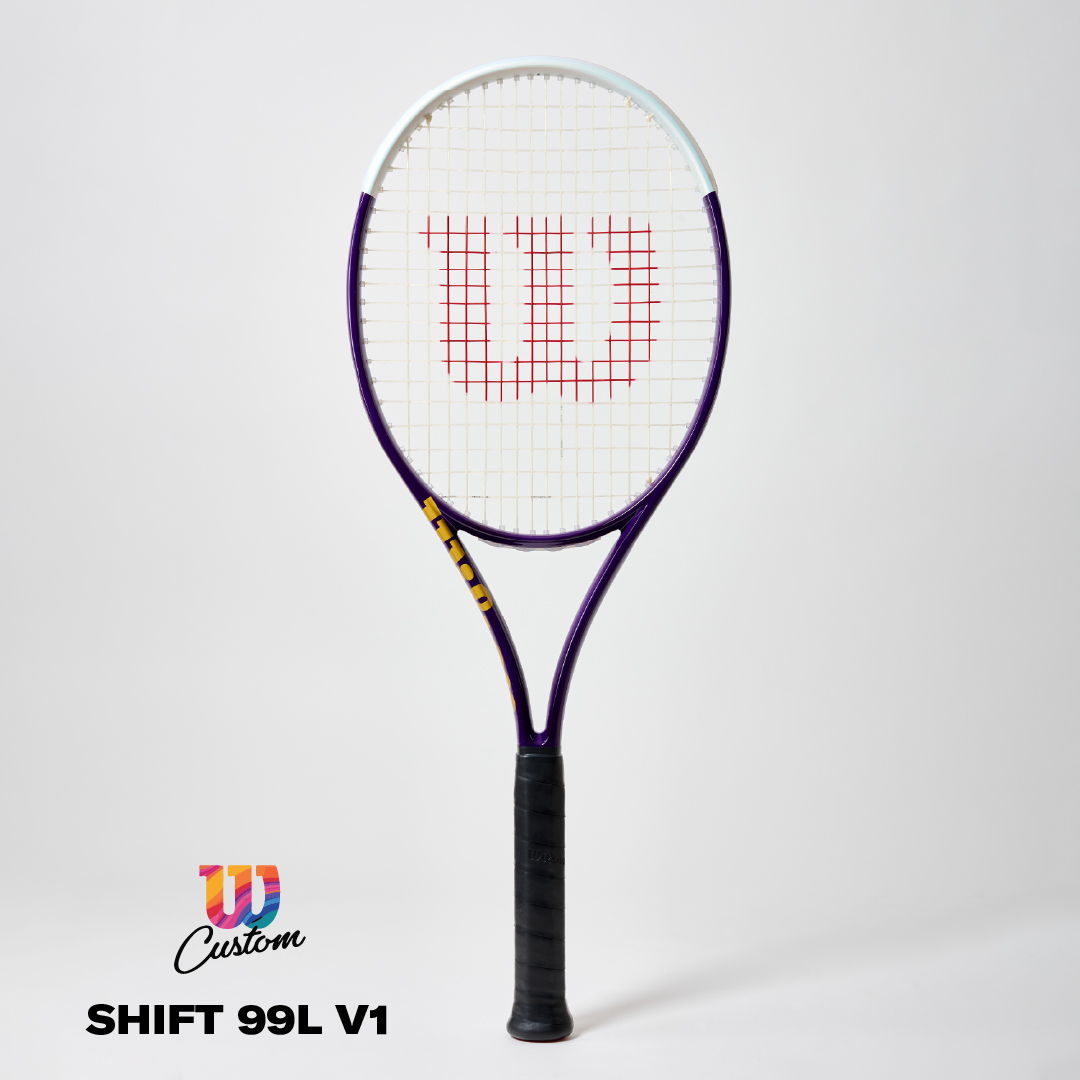 A tennis racket with a purple frame and Wilson logo on the strings.