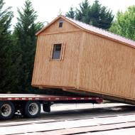 shed being delivered by truck