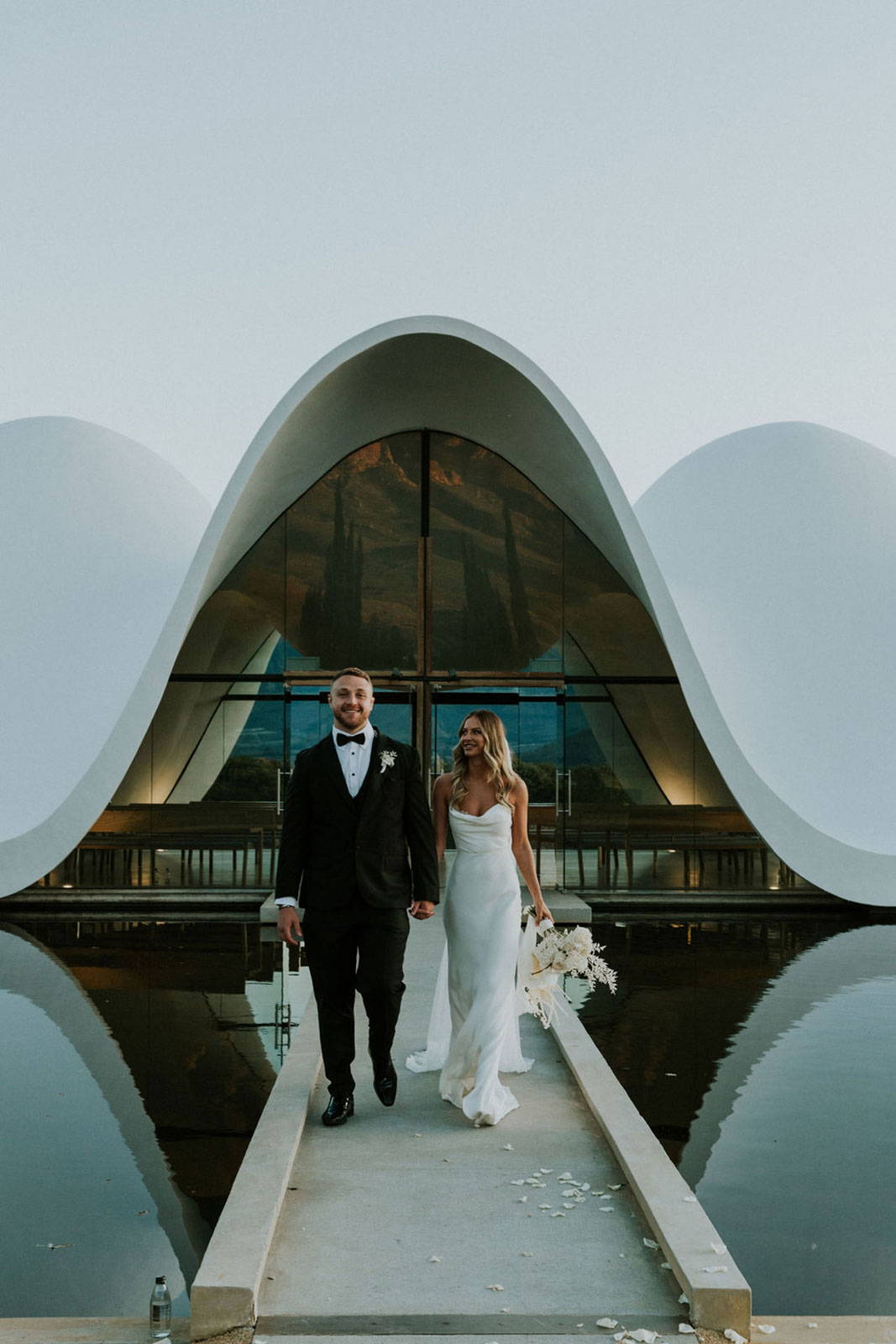 Bride and Groom in front of wedding reception venue