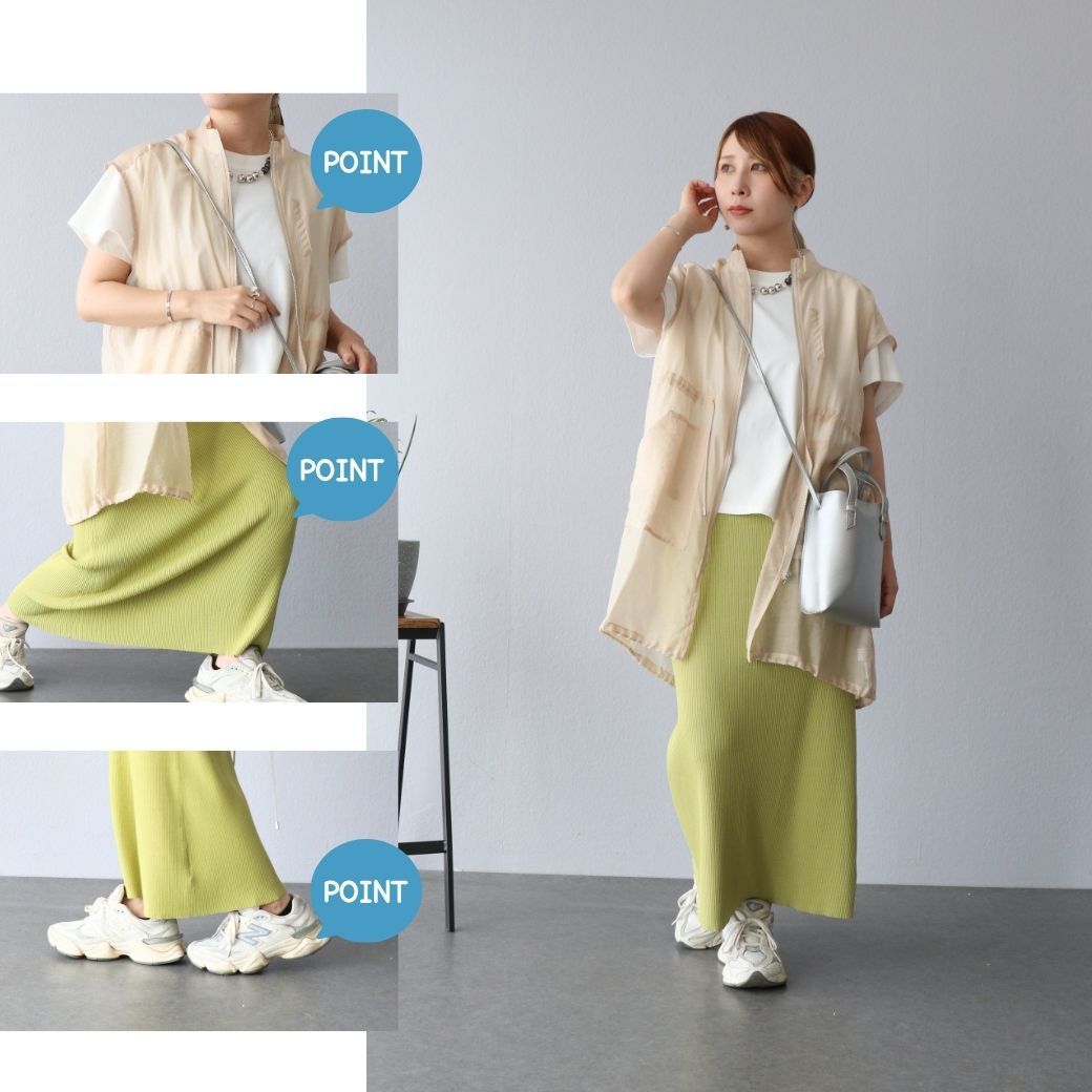 Woman in stylish outfit posing in a modern interior setting.