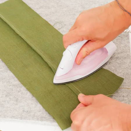 Press to the wrong side before sewing the flat felled seam