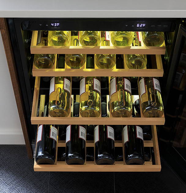 Wine and Beverage Center open with drawers full and extended.