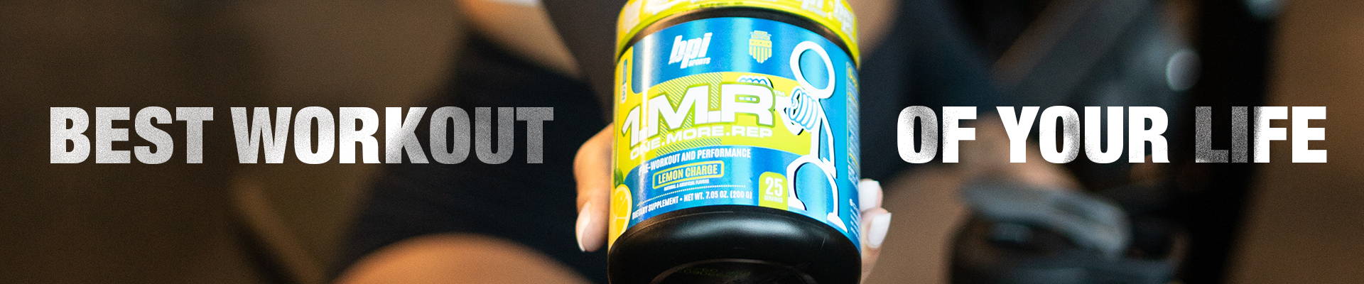 Athlete showing a bottle of 1.M.R.™. Best Workout of your Life