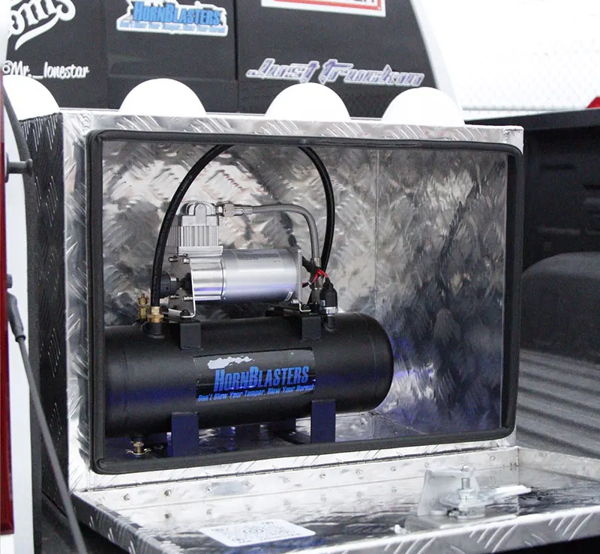 HornBlasters compressor and air tank inside diamond-plate toolbox in Cristian's truck bed photo 4