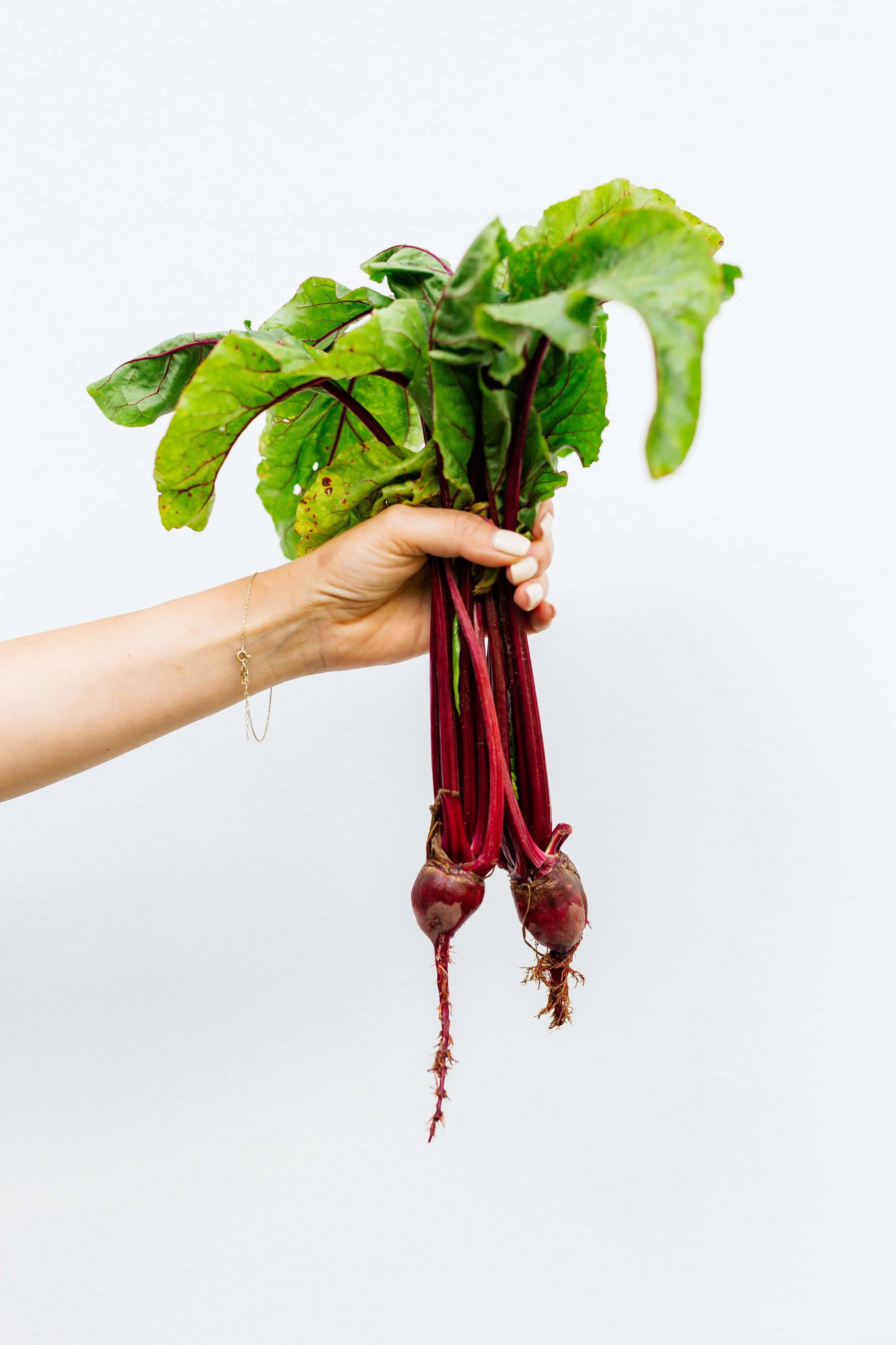 hand holding beetroot
