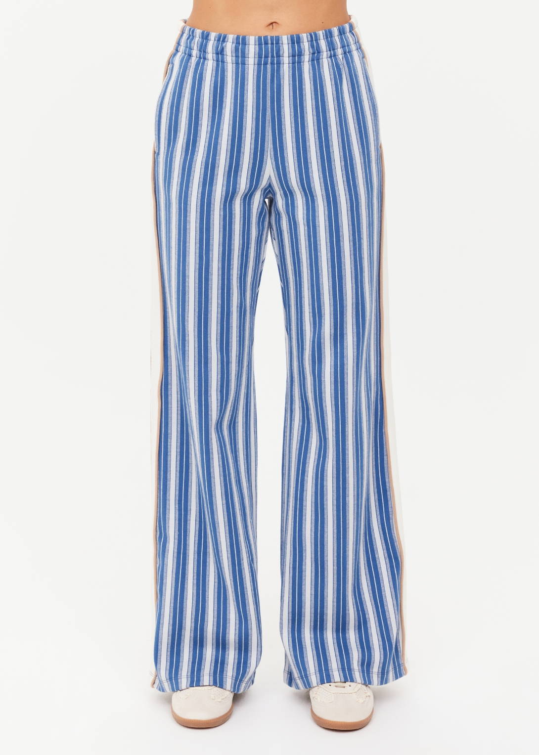 Striped blue wide-leg pants worn by a model.