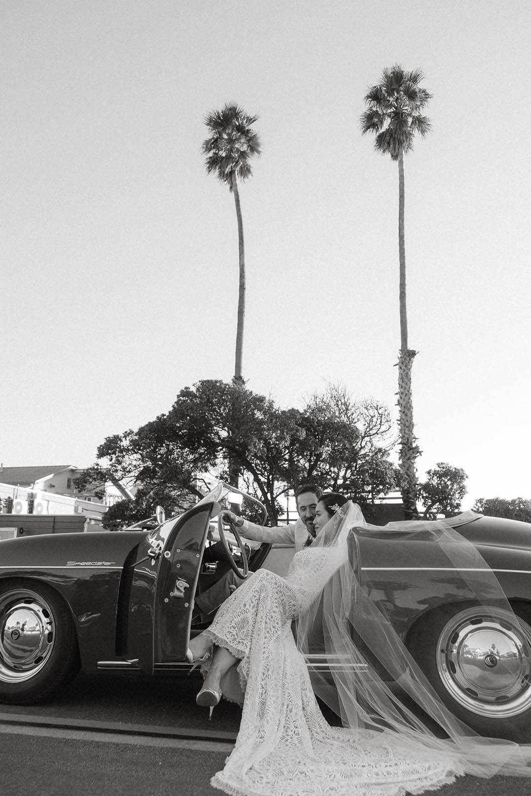 Bride and groom in vintage car