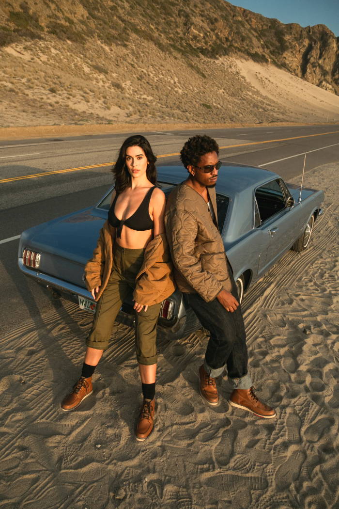 male and female model wearing  Levis Daleside boots by the beach 