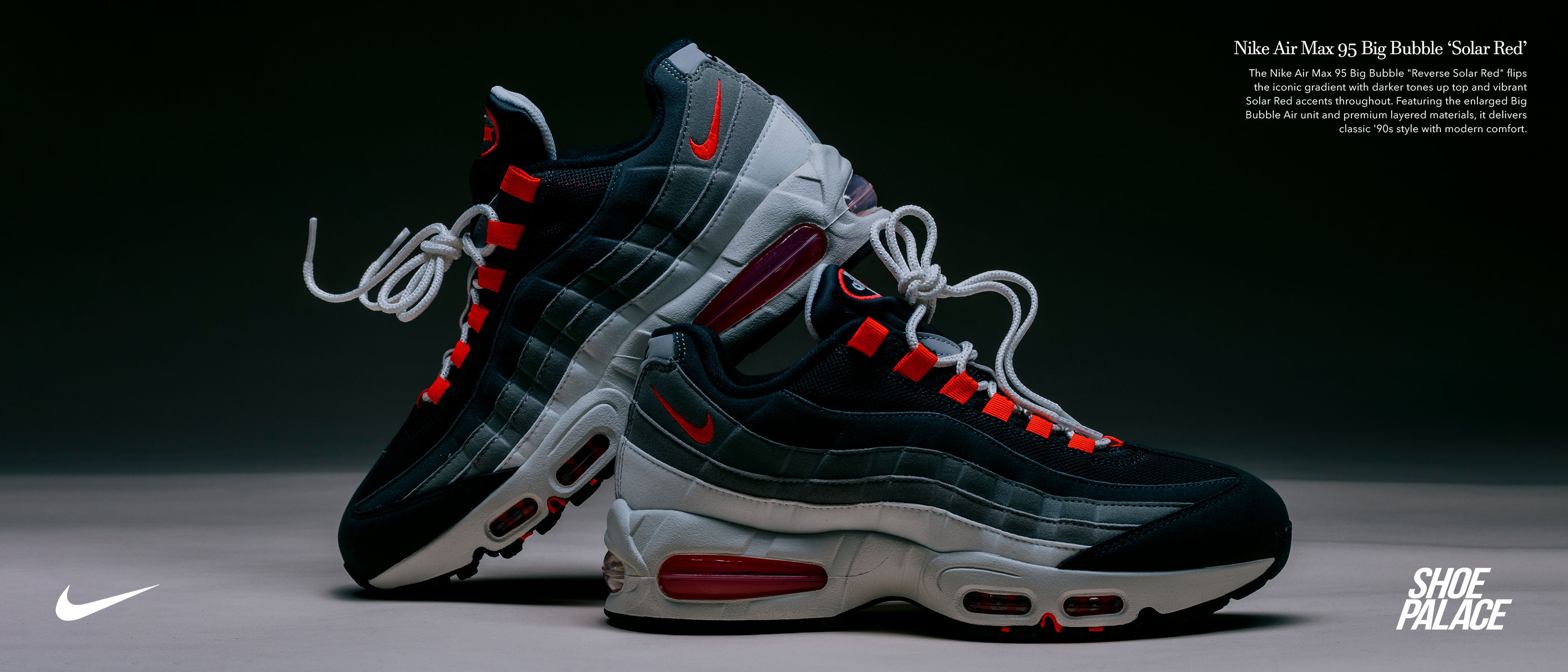 Nike Air Max 95 sneakers in black, red, and gray colors on display.