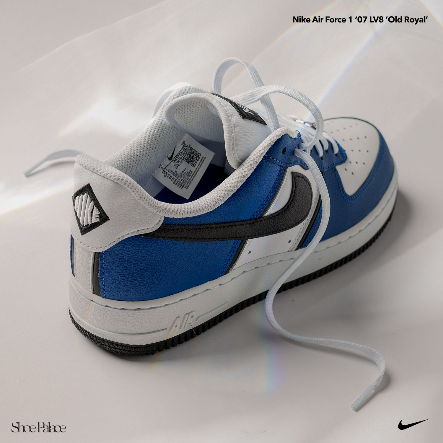 Nike Air Force 1 sneaker in blue, white, and black colorway.
