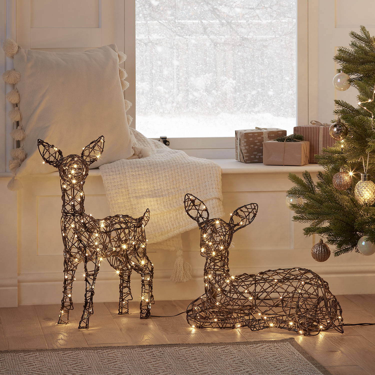 2 Studley fawns in an indoor Christmas setting.