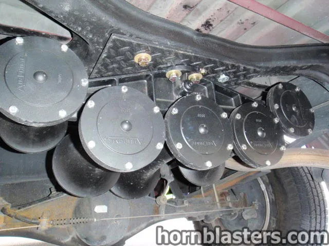 Five-bell AIRCHIME Nathan K5 train horns black mounting bracket bolted to frame diamond plate undercarriage Dennis's 2000 Toyota Tundra customer install gallery photo 4