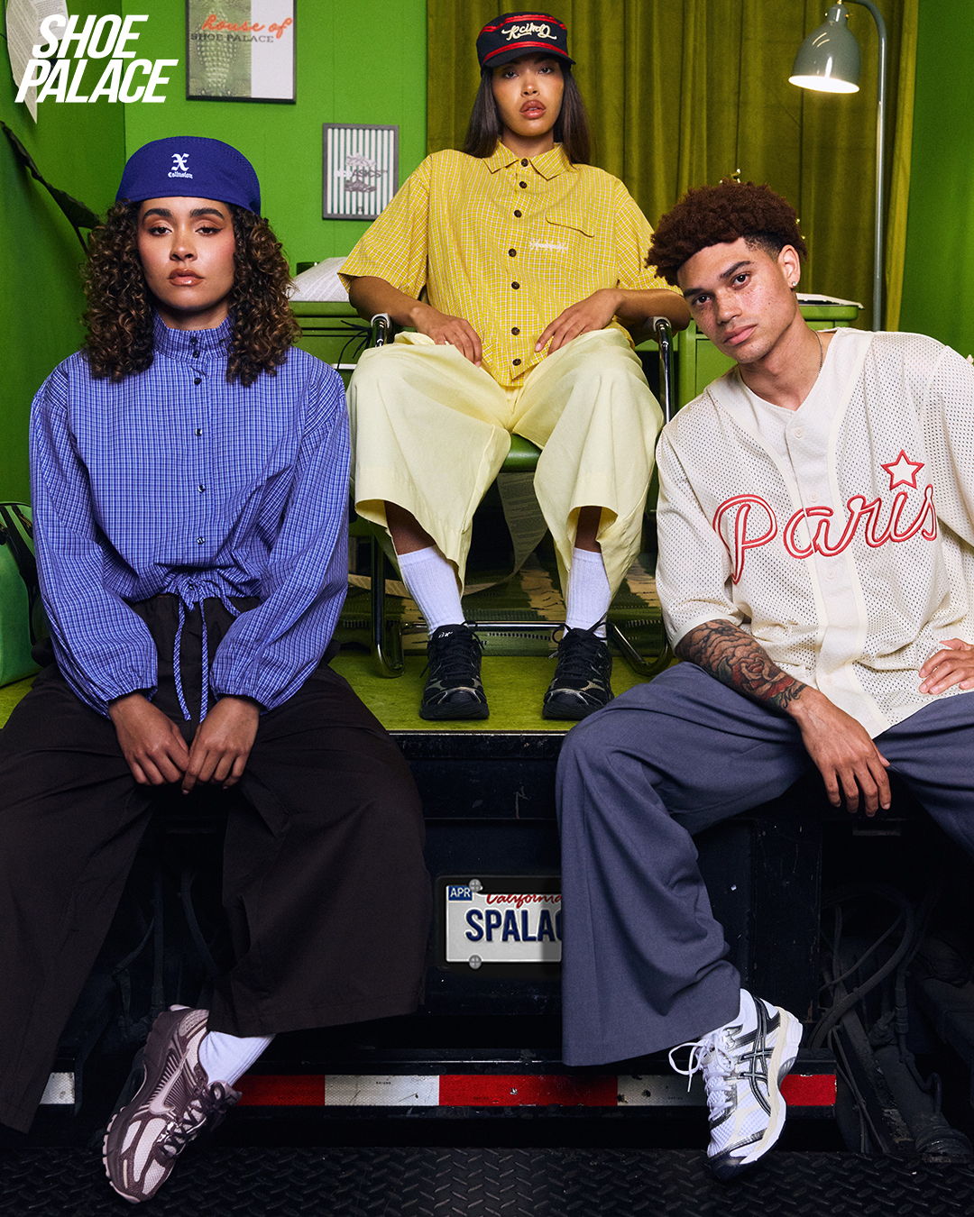 Three fashionable individuals posing in casual outfits against a vibrant background.