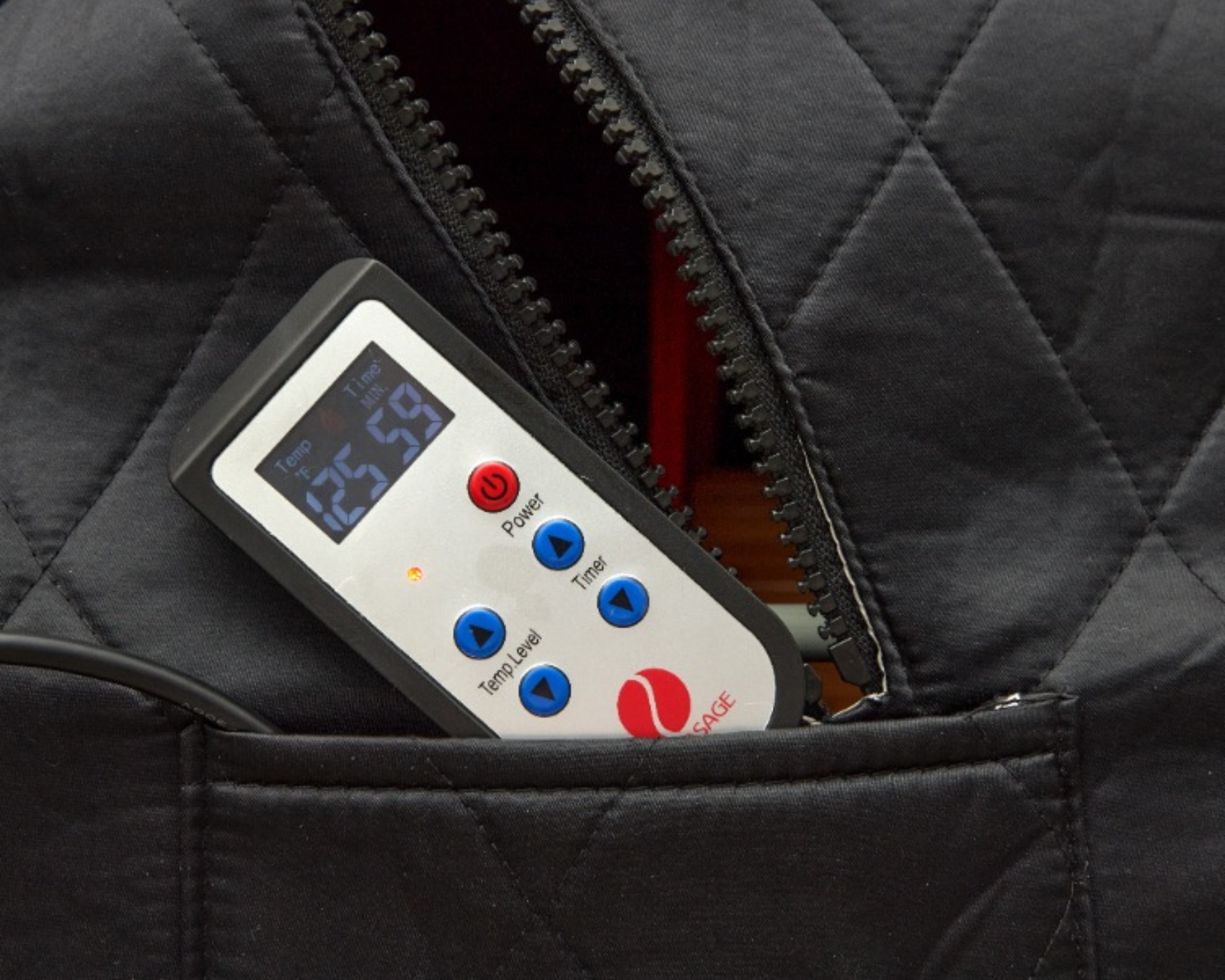 Remote control partially visible in a black quilted jacket pocket.