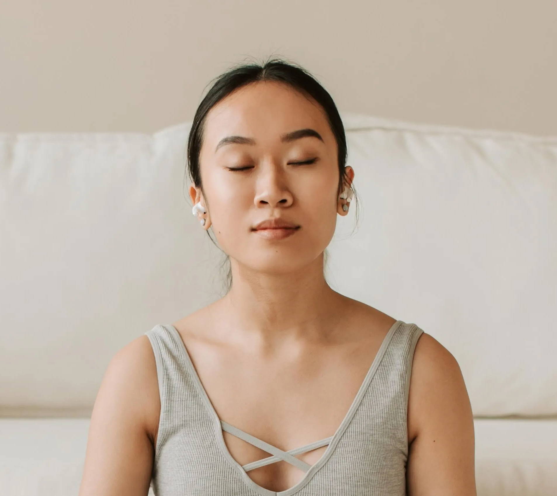 Women eyes closed meditating 
