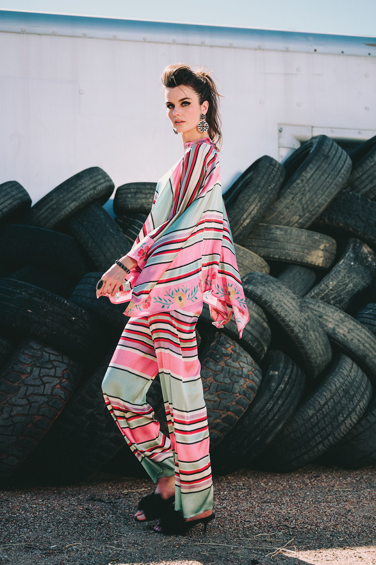 Kaylin wearing the Round Top Serape Poncho and Pant with Double D Ranch accessories and jewelry. 