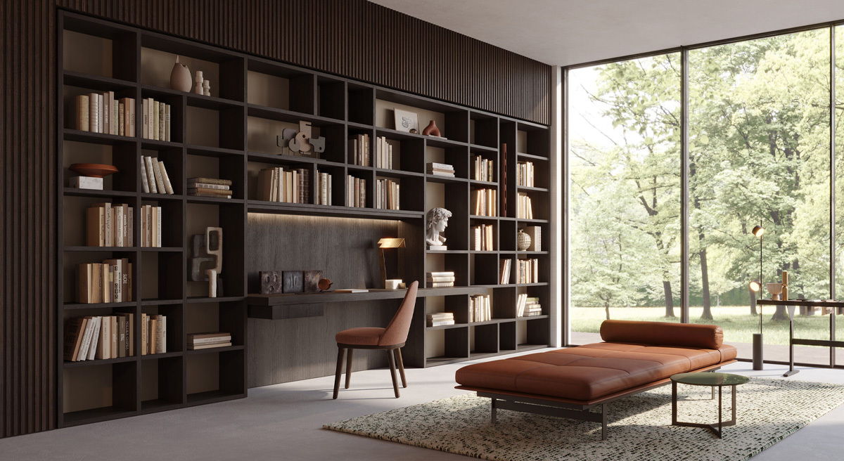 Modern interior with a bookshelf, desk, chair, and large windows.