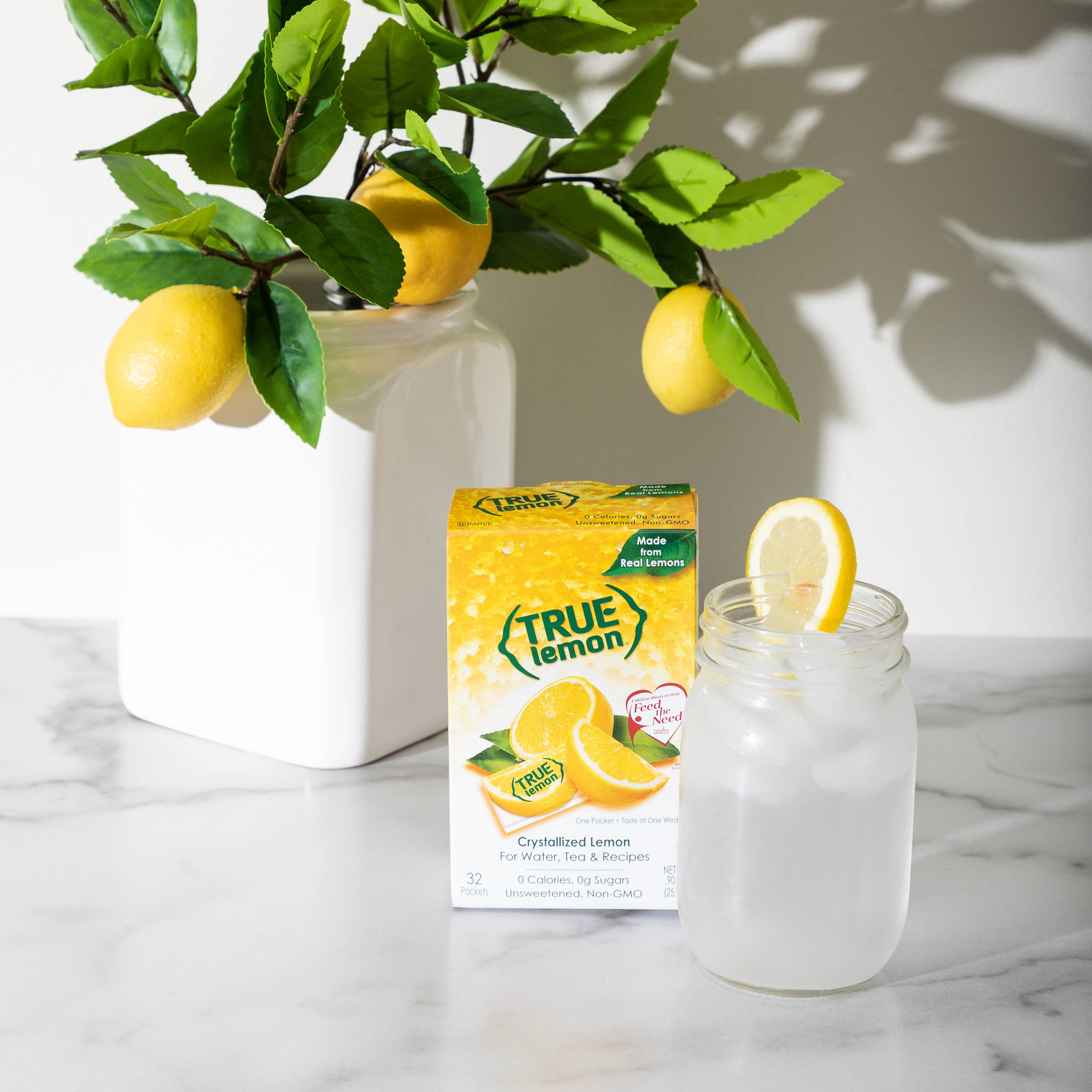 Lemon tree ,true lemon lemon flavoring packets. Jar with water and lemon slice.