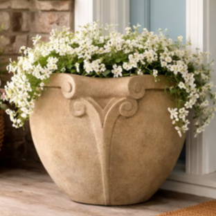 Rangoon planter on porch with white flowers